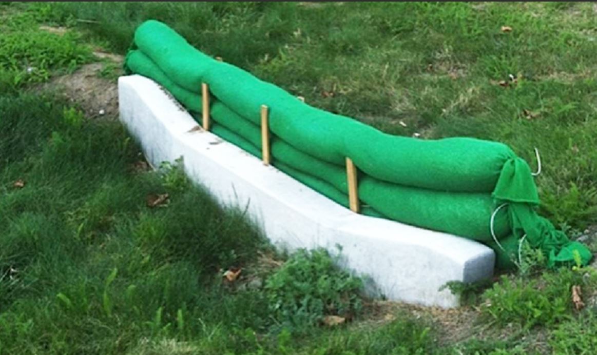 Green silt socks set up to prevent erosion