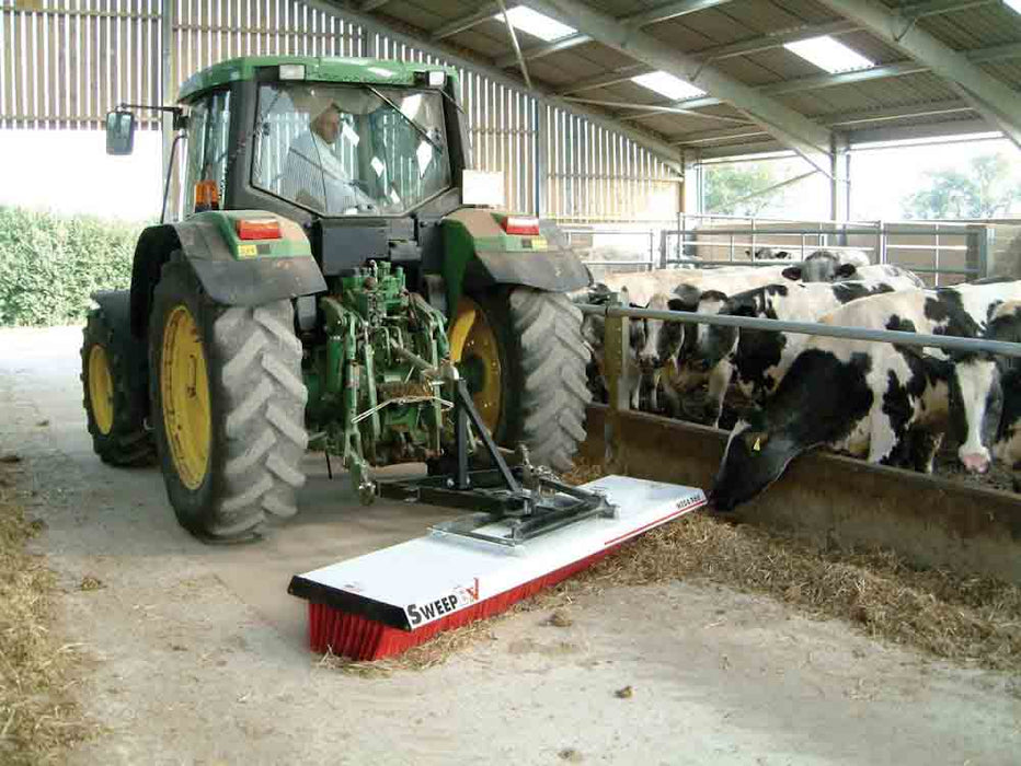 Tractor using a mega broom to sweep 