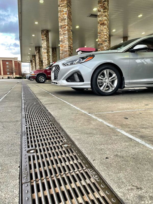 ACO FG200 channel drain at a fuel station forecourt
