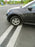 SUV parked over an ACO FG200 trench drain at a gas station
