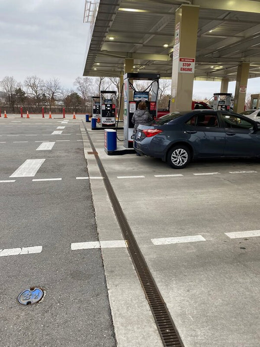 ACO K100 trench drain installed at a gas station forecourt
