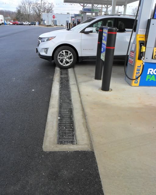 ACO K200 trench drain along a gas station pump island
