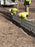 ACO K300 channel drain sections set in a trench during installation
