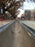 ACO K300 polymer concrete channel being installed along a city street
