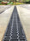 ACO K300 slotted trench drain along a concrete driveway
