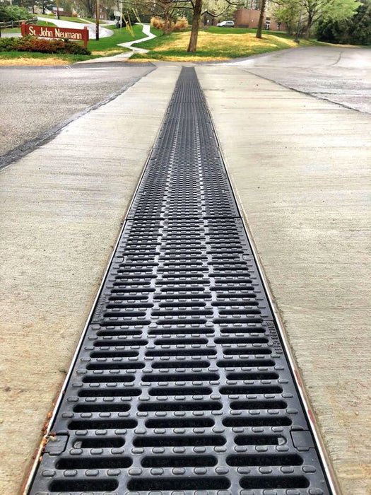 ACO K300 slotted trench drain along a concrete driveway
