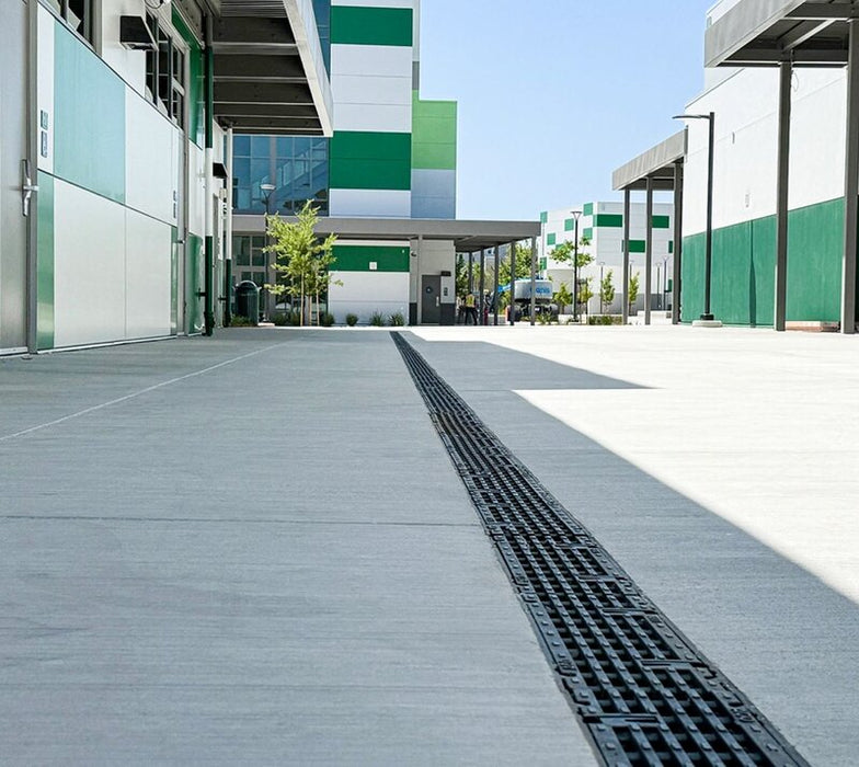 ACO PowerDrain S100K channel drain outside a commercial building
