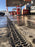 ACO PowerDrain S100K channel drain at a fuel station forecourt
