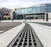 ACO PowerDrain S100K trench drain outside an arena
