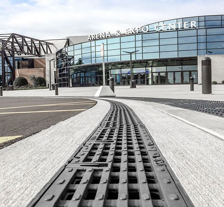 ACO PowerDrain S100K trench drain outside an arena
