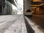 ACO PowerDrain S200K channel drain at a commercial plaza entrance
