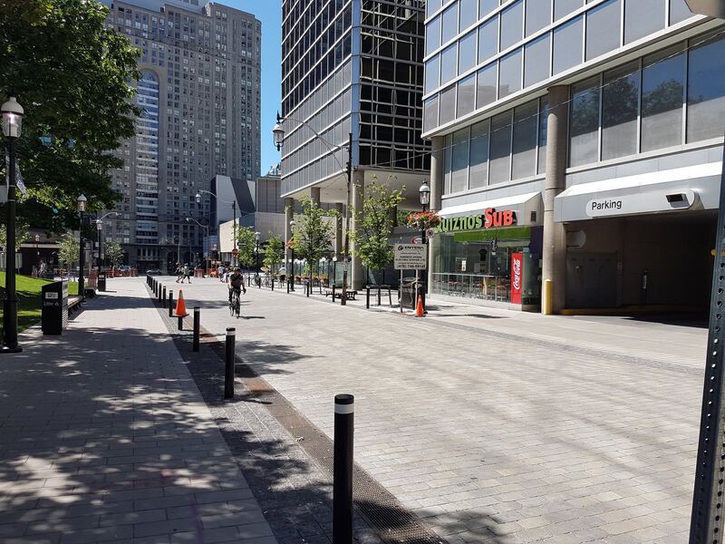 ACO PowerDrain S200K trench drain along an urban pedestrian streetscape
