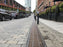 ACO PowerDrain S300K trench drain along an urban streetscape
