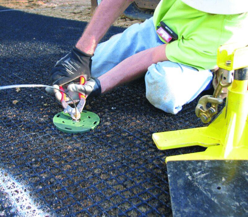 Close-up of an anchor pin securing Enkamat R45 turf reinforcement mat
