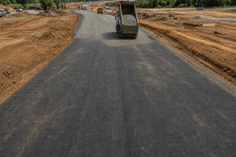 Geotextile fabric under gravel on a new subdivision road
