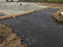 Non-woven geotextile fabric under the gravel subgrade of a concrete slab
