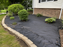 Non-woven geotextile landscape fabric in a large garden bed with shrubs and perennials
