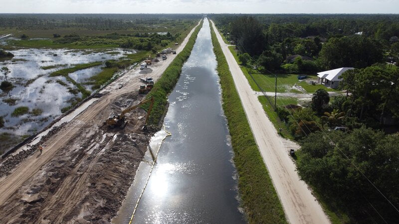 Aerial view of Pyramat erosion control along a canal bank during construction
