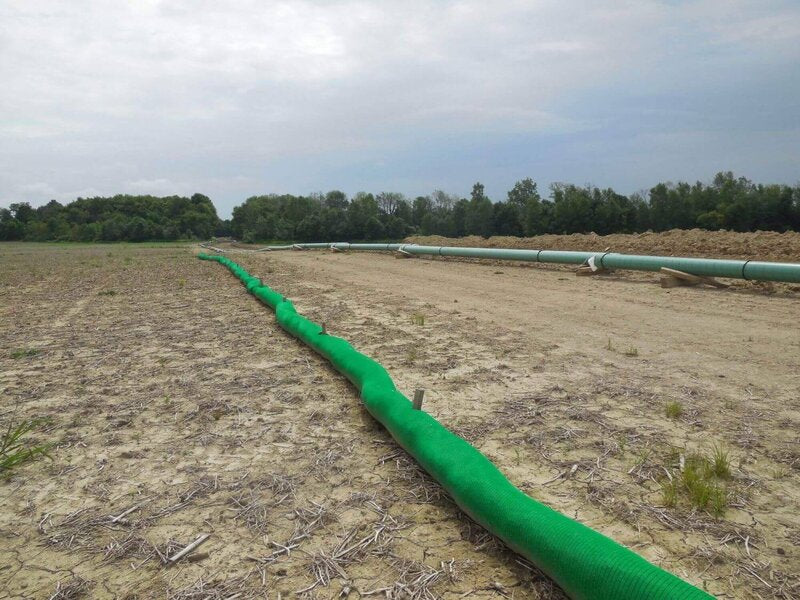 Silt sock installed for perimeter control alongside a pipeline construction corridor
