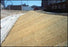 Straw erosion blanket on slope
