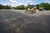 Woven geotextile fabric under gravel in an overflow gravel parking lot
